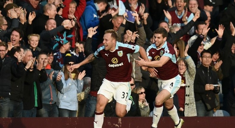 Burnley's midfielder Scott Arfield (L) celebrates scoring their second goal during the English Premier League football match between Burnley and Everton at Turf Moor in Burnley, north west England on October 22, 2016