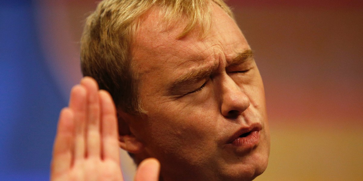 Liberal Democrat party leader Tim Farron gestures during a keynote speech on the final day of the party's conference in Bournemouth, 2015.