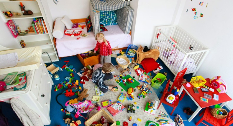 A pair of kids play in a messy toy room.Cultura RM Exclusive/Henglein and Steets/Getty Images