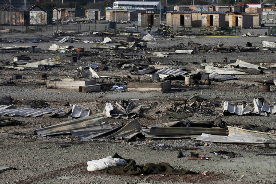 General view of shelters the day after a fire destroyed large swathes of the Grande-Synthe migrant camp near Dunkirk in northern France April 11, 2017 following skirmishes on Monday that injured several people.