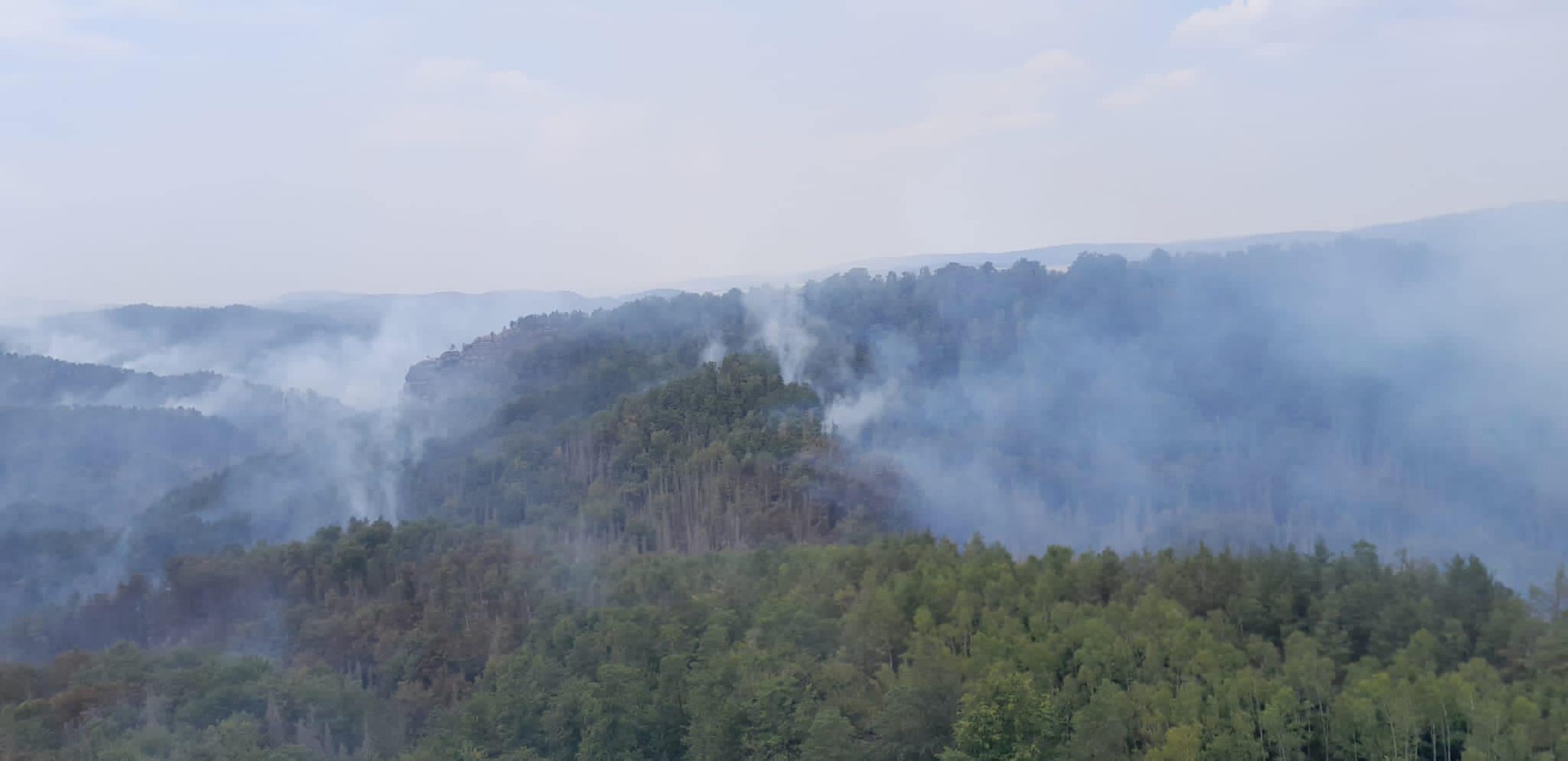 Hasenie požiarov v Národnom parku České Švajčiarsko.