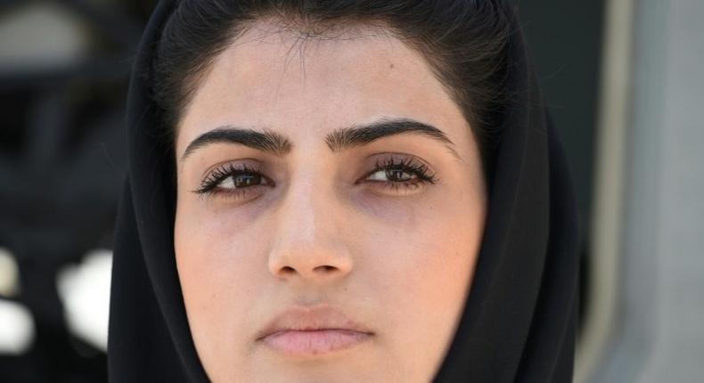 In a picture taken on April 26, 2015, Afghanistan's first female pilot, Niloofar Rahmani, poses for a photograph at an Air Force airfield in Kabul