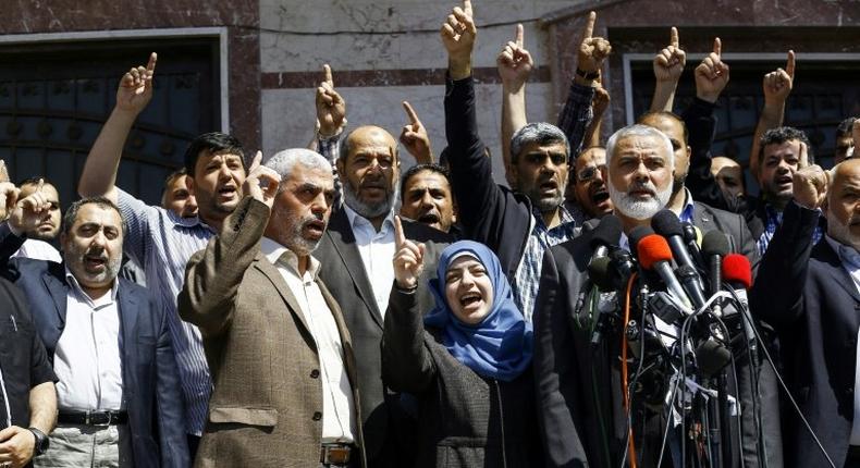 Ismail Haniya (R-2), leader of the Palestinian Islamist movement Hamas, gives a press conference in Gaza City on May 11, 2017, announcing the arrest of the suspected killer of one of its key military commanders, Mazen Faqha
