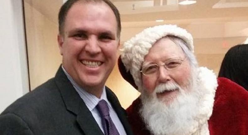 'Devout' Catholic Bill Metzger posing for a selfie with Santa