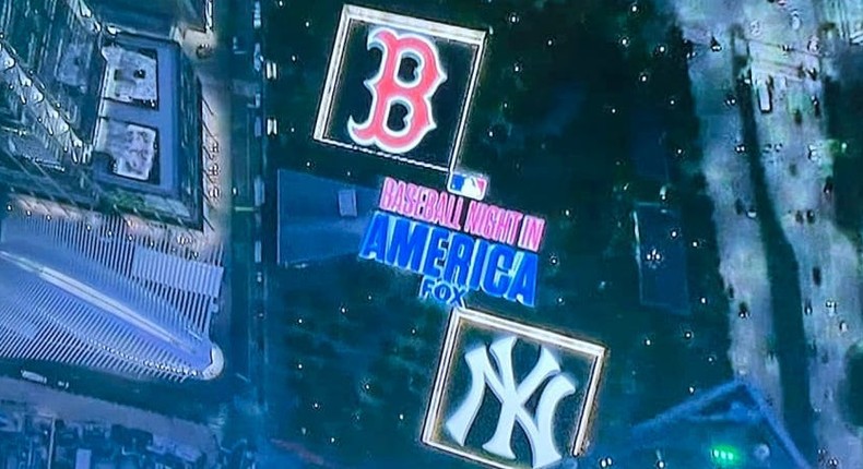 The Baseball Night in America logo, alongside the Yankee and Red Sox logo, superimposed onto an image of the 9/11 memorial pools