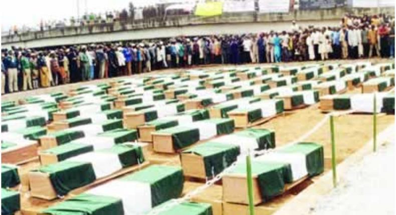 A picture from the mass burial for the Ikeja Cantonment bomb blast victims now buried at Oke-Afa road, Isolo, Lagos. (Punch Newspapers)