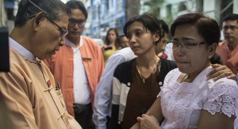 Tin Tin Aye (right), the widow of murdered Muslim lawyer Ko Ni, is comforted by Tin Oo of the ruling National League for Democracy party in Yangon on January 30, 2017