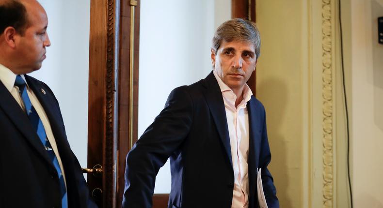 Argentina's new Finance Minister Luis Caputo arrives for a news conference at Casa Rosada presidential palace in Buenos Aires, Argentina, Friday, Dec. 30, 2016. Caputo and Argentina's new Treasury Minister Nicolas Dujovne replace outgoing Finance Minister Alfonso Prat-Gay who was fired by President Mauricio Macri on Monday, Dec. 26.