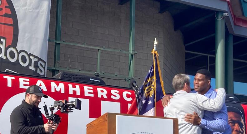 Georgia Gov. Brian Kemp campaigns alongside GOP Senate nominee Herschel Walker in Smyrna, Ga., on November 19, 2022.AP Photo/Bill Barrow