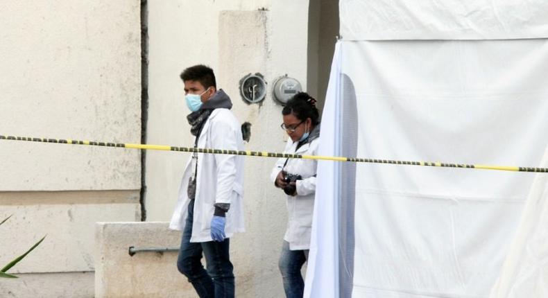 Forensic personnel work on a crime scene where attackers burst into a party and killed 11 people in Tizayuca, Mexico