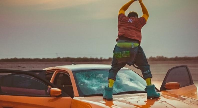 Shatta Wale destroys expensive car windscreen during video shoot