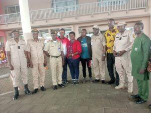 Men of Nigeria Immigration Service, Seme Area Command in a group photograph with Delegate from Ghana shortly after arrival of 66 trafficked Nigerians from Ghana in Seme. [NAN]