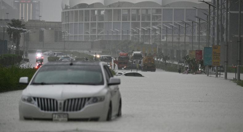 Vehicles hardly move on flooded streets due to heavy rain in Dubai on April 16, 2024.Stringer/Anadolu/Getty Images