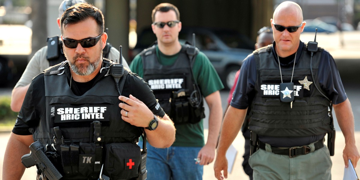 Officers at the Orlando Police Headquarters during the investigation of the shooting at the Pulse nightclub, where people were killed by a gunman, in Orlando, Florida, on Sunday.