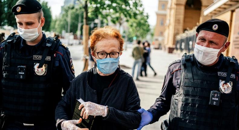 A protester is arrested in Moscow on Thursday