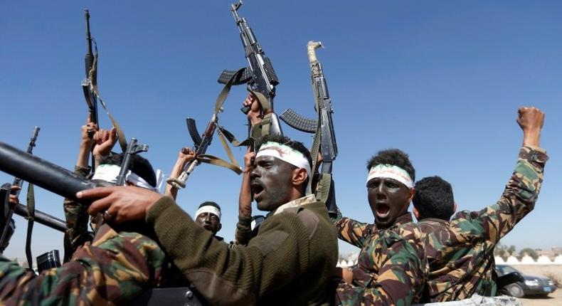 Newly recruited Houthi fighters chant slogans as they ride a military vehicle during in the Yemeni capital Sanaa on January 3, 2017