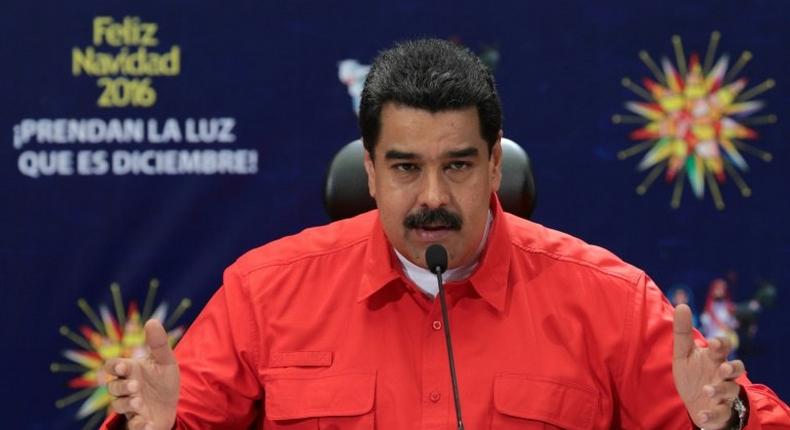 Photo released by the Venezuelan Presidency of Venezuelan President Nicolas Maduro speaking during his TV program Contacto con Maduro (Contact with Maduro) in Caracas on December 11, 2016