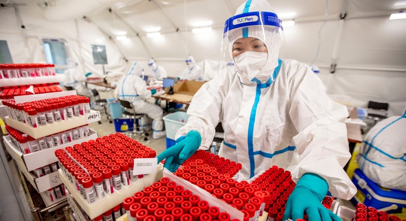 Volunteers input test tube information for nucleic acid collection in a gas film laboratory for COVID-19 prevention and control in Anyang, Henan Province, China, Sept 5, 2022.CFOTO/Future Publishing via Getty Images