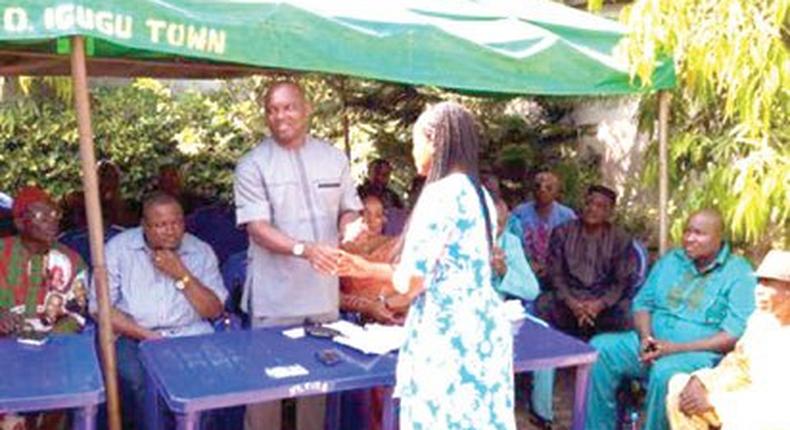 Hon. Ezugwu, Enugu House Leader disbursing a cheque during the exercise