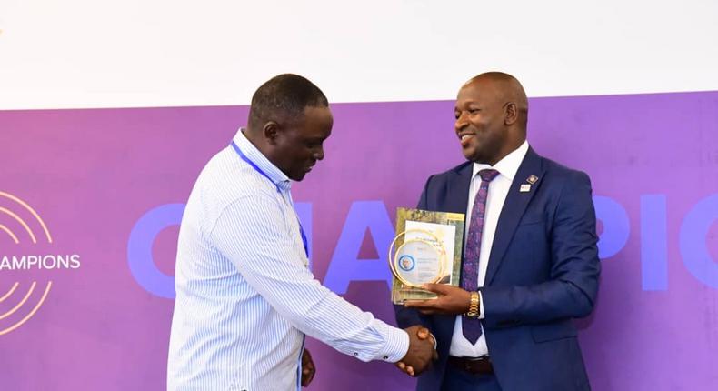 Next Media Group CEO Kin Kariisa (left) receiving the accolade at the 99th District 9214 Rotary Leadership Conference held in Munyonyo.