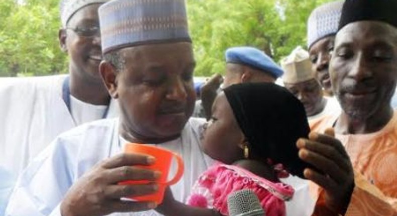 Governor Atiku Bagudu Of Kebbi State, Deworming A Child During Maternal Newborn And Child Health Week In Birnin Kebbi on August 10, 2015.