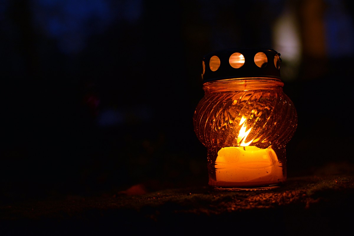 Yellow,Grave,Candle,(lantern),Standing,On,A,Pavement,Of,A