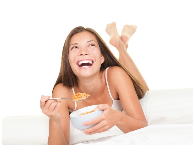 10963_-breakfast-in-bed-happy-woman-enjoying-cornflakes-cereals-in-the-bed-in-the-morning-shutterstock_56933509