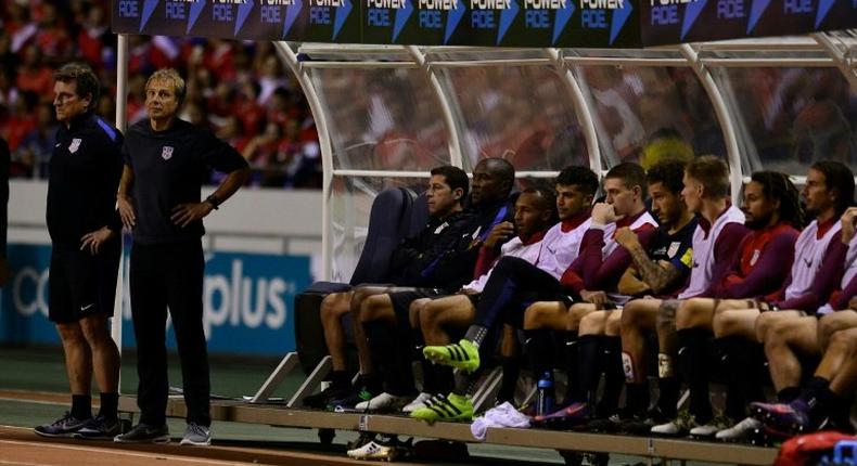 United States' players on the bench react during their 2018 FIFA World Cup qualifier football match against Costa Rica on November 15, 2016