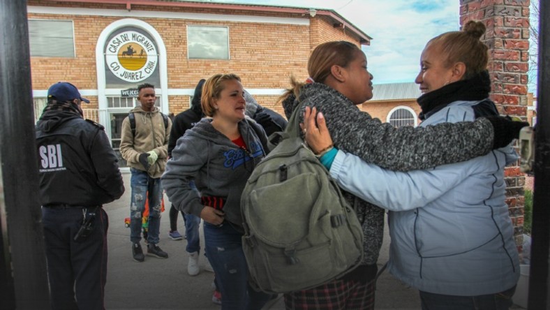 Cuban and Central American migrants leave the Casa del Migrante shelter in Ciudad Juarez, Mexico, before heading to the border to request political asylum in the United States