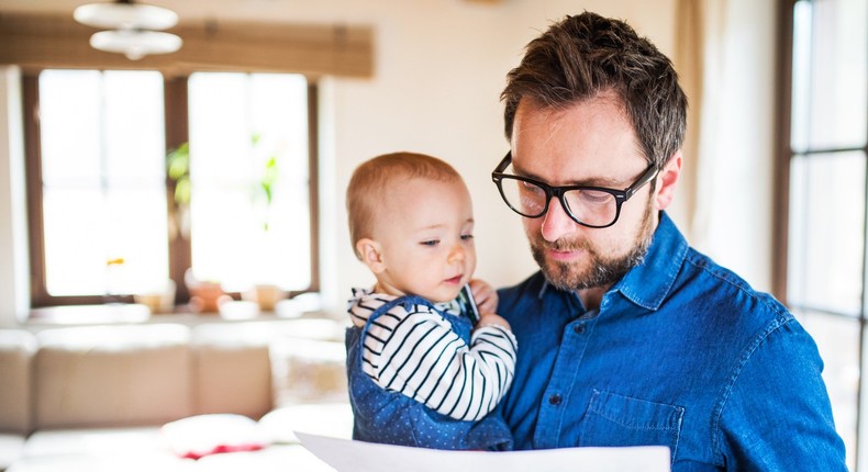 dad with baby in arms