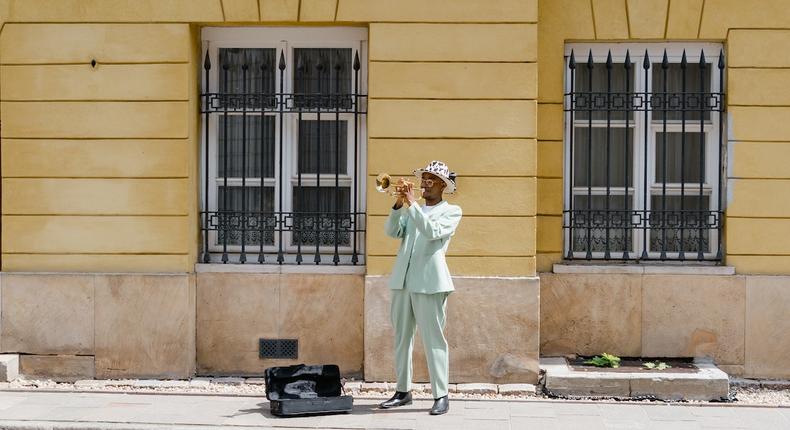 Man playing the trumpet in the street [Image: Mart Production]