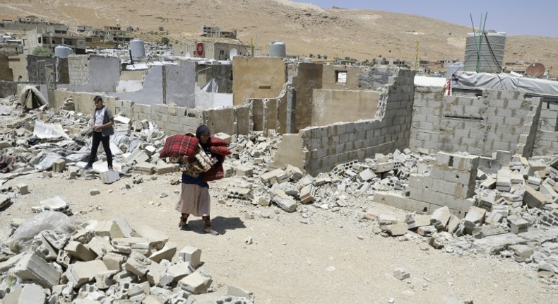 Syrian refugees have been ordered by the Lebanese government to demolish cinderblock shelters