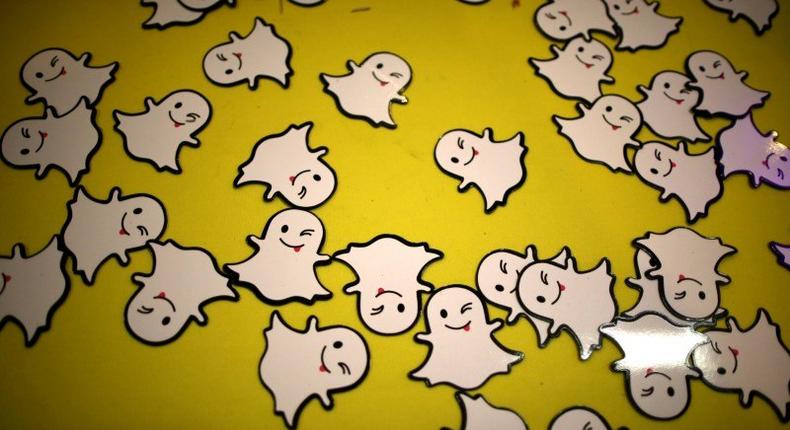 FILE PHOTO - The logo of messaging app Snapchat is seen at a booth at TechFair LA, a technology job fair, in Los Angeles