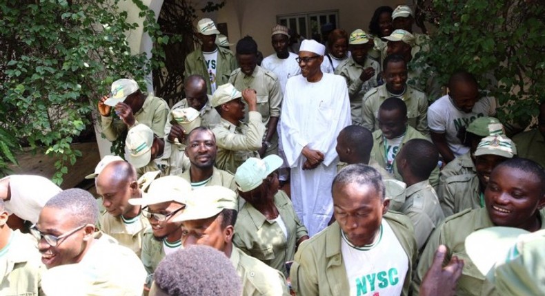 President Muhammadu Buhari with corps members [Presidency]