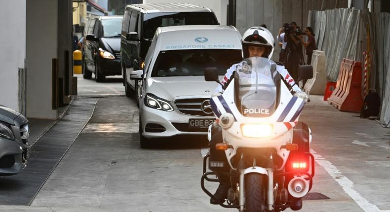 A hearse transporting Mugabe's body left a Singapore funeral parlour accompanied by a police escort