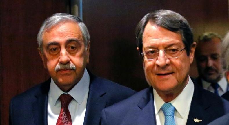 Greek Cypriot leader Nicos Anastasiades (R) and Turkish Cypriot leader Mustafa Akinci (L) arrive to attend a meeting with UN Secretary-General Antonio Guterres on June 4, 2017 at UN Headquarters in New York
