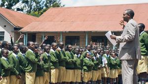 A photo of a teacher addressing Alliance High School students