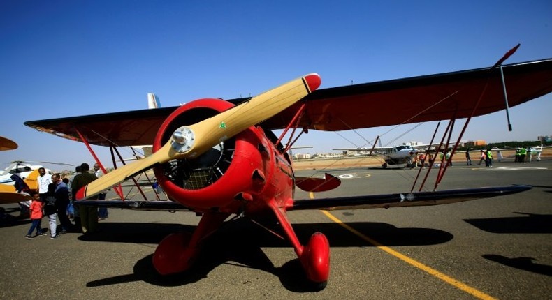 A Waco YMF-5D biplane sits on the runway on November 20, 2016 in Khartoum airport during the Vintage Air Rally