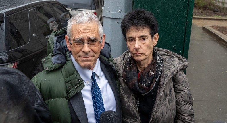 Sam Bankman-Fried's parents, Joseph Bankman and Barbara Fried, face reporters outside a federal courthouse after he was sentenced to 25 years in prison.DAVID DEE DELGADO/Getty