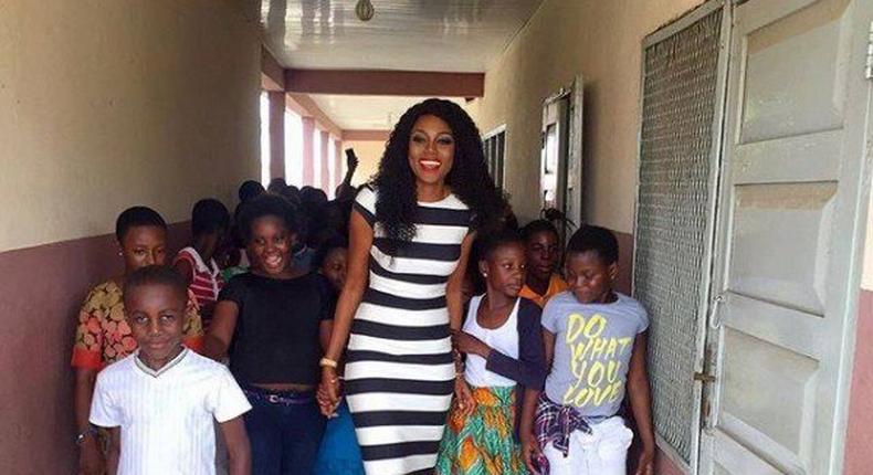 Yvonne Nelson and some pupils of St. Martin De Porres Schoo