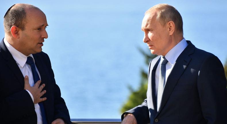 Russian President Vladimir Putin (R) speaks with Israeli Prime Minister Naftali Bennett during their meeting, in Sochi, on October 22, 2021.YEVGENY BIYATOV/Sputnik/AFP via Getty Images