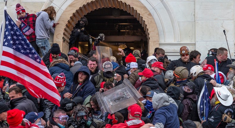 Police use tear gas around Capitol building where pro-Trump supporters riot and breached the Capitol on January 6, 2021.
