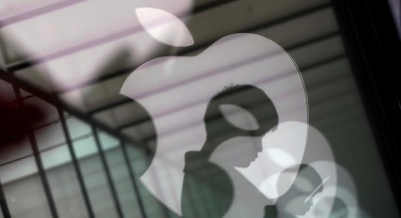 FILE PHOTO: Apple company logos are reflected on the glass window outside an Apple store in Shanghai, China, Jan. 3, 2019. REUTERS/Aly Song/File Photo