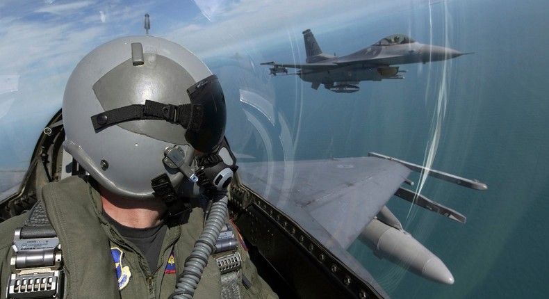 F-16 Fighting Falcons from the 62nd Fighter Squadron, Luke Air Force Base, Ariz., fly over southern Florida during a flight from Luke to Key West, Fla., Oct. 16, 2004.Stocktrek Images/Getty Images