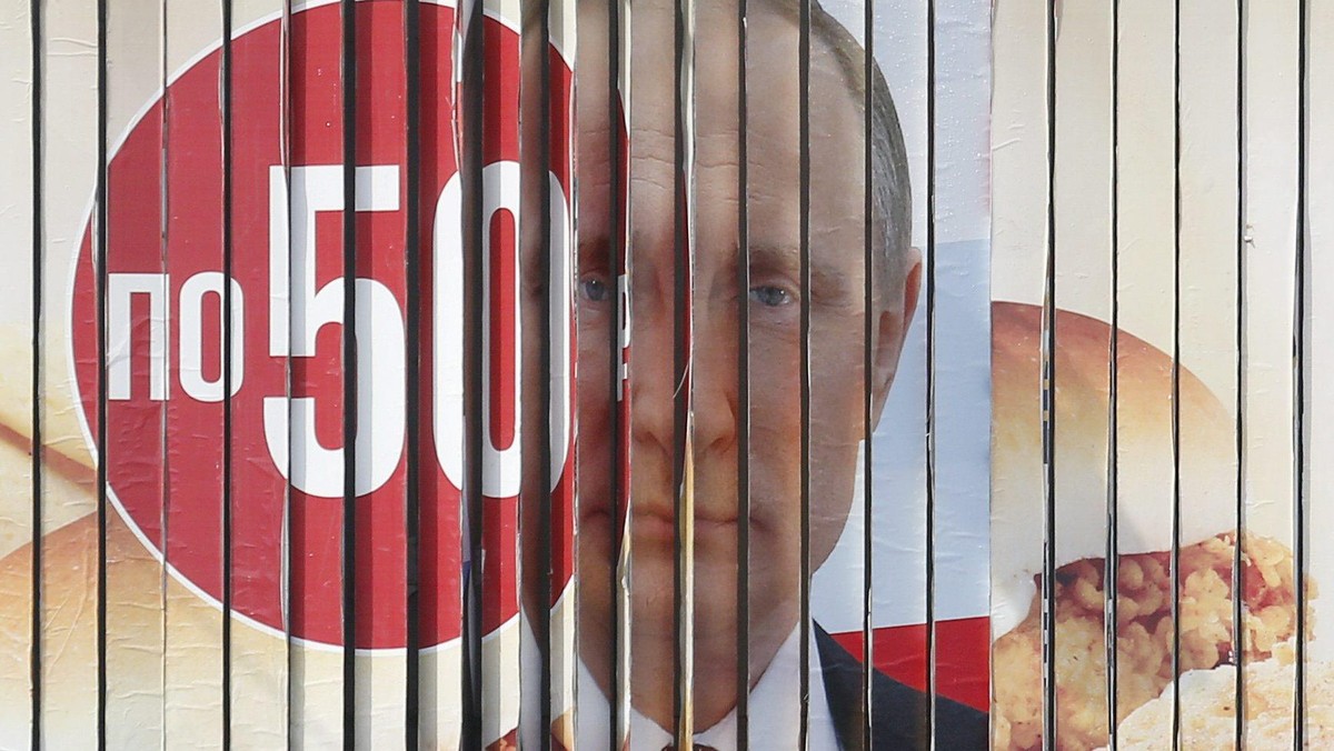 A board, advertising the campaign of Russian President Putin ahead of the presidential election, is 