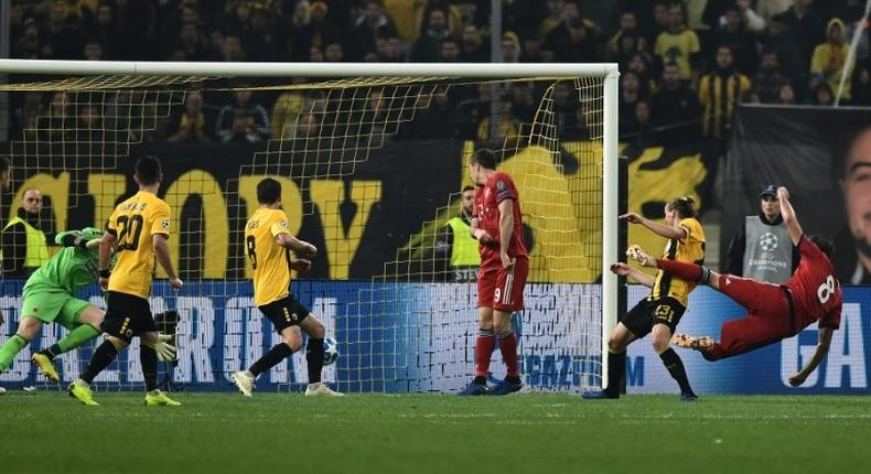 Bayern Munich midfielder Javi Martinez (R) scored the opening goal with a acrobatic half-volley before Robert Lewandowski (R) added a second as teh reigning German champions scored two second-half goals in as many minutes at AEK.