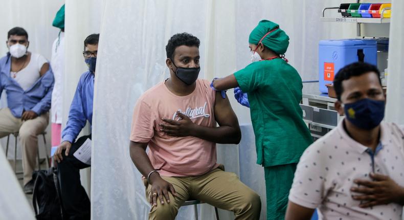 People are administered COVID-19 vaccine in Mumbai, India, Tuesday, April 13, 2021.
