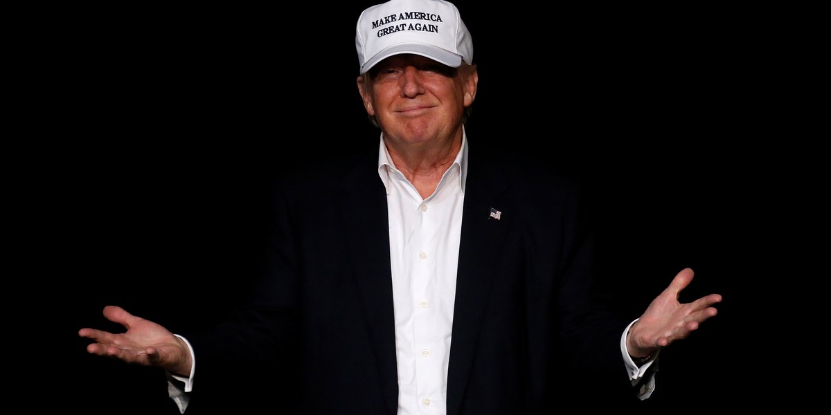 Republican presidential nominee Donald Trump walks on stage during a campaign event in Dimondale, Michigan, U.S., August 19, 2016.