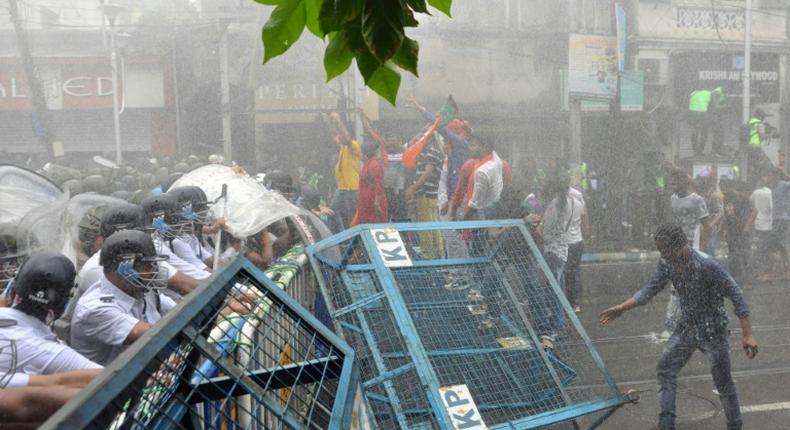 Bharatiya Janata Party activists clash with police during a rally in Kolkata on June 12, 2019