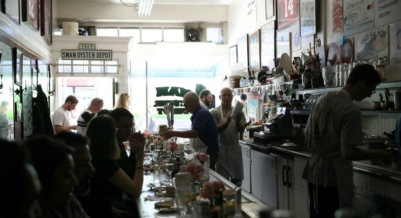 Swan Oyster Depot patrons sit in the dark during a citywide power outage on April 21, 2017 in San Francisco, California